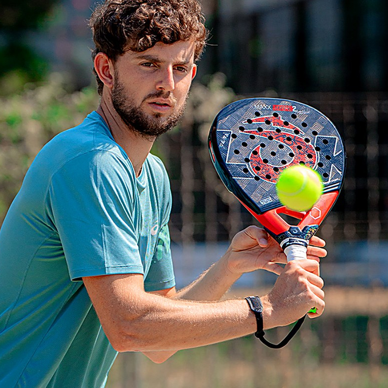 Mike Yanguas hitting a volley with his LOK Maxx racket on court